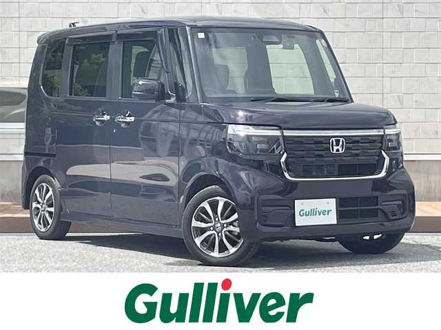ホンダ Ｎ ＢＯＸ カスタム 滋賀県 2024(令6)年 2.9万km トワイライトミストブラックパール 純正8インチナビ（VXM-245ZFEi）/(AM/FM/BT/iPod/USB/フルセグTV)/片側パワースライドドア/コーナーセンサー/ホンダセンシング/衝突軽減ブレーキ/レーントレーシングアシスト/レーダークルーズコントロール/バックカメラ/ビルトインETC/前後ドライブレコーダー/シートヒーター(D/N)/ステアリングスイッチ/電動サイドブレーキ/オートライト/プッシュスタート/純正フロアマット/ドアバイザー/電格ウインカーミラー