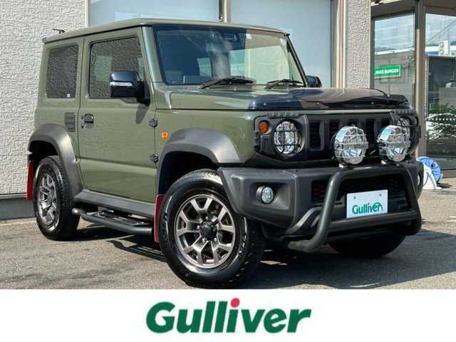 スズキ ジムニー シエラ JC 大阪府 2022(令4)年 1.4万km ジャングルグリーン ワンオーナー/IPFオフロードランプ/CARSTYLEサイドダクトプロテクター/純正８インチSDナビ/（フルセグ／ＢＴ／ＣＤ／ＤＶＤ）/バックカメラ/クルーズコントロール/レーンキープアシスト/衝突被害軽減システム/横滑り防止装置/ダウンヒルアシストコントロール/ヒーテッドドアミラー/前席シートヒーター/純正15インチAW/前後ドライブレコーダー/ETC/保証書/取扱説明書