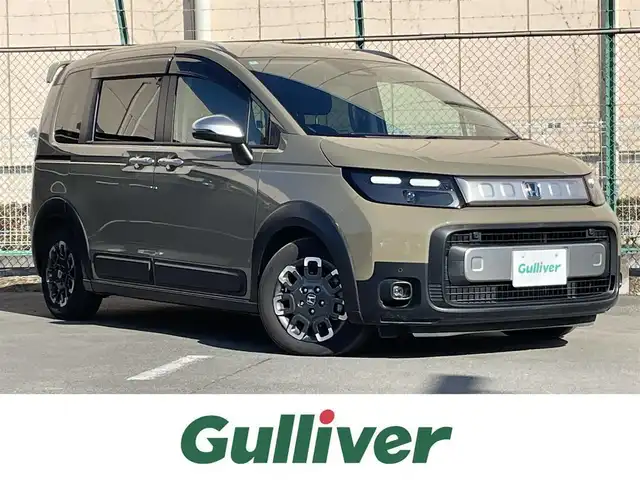 ホンダ フリード ハイブリット e:HEV クロスター 東京都 2024(令6)年 1.5万km 緑 純正メモリナビ＆フルセグ/AppleCarPlay/AndroidAuto/BluetoothAudio/USB/両側パワスラ/ＬＥＤヘッドライト　/ホンダセンシング/衝突軽減ブレーキ/先行車発進お知らせ機能/ブラインドスポットモニター　/アダプティブクルーズコントロール　/路外逸脱抑制機能 /パーキングセンサーシステム　/車線維持支援システム /オートハイビーム  /プッシュエンジンスタート/スマートキー/保証書＆取説