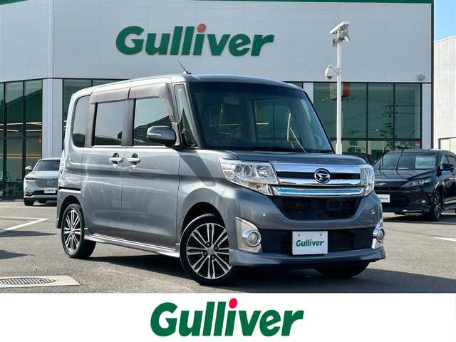 ダイハツ タント カスタム RS トップED SA 愛媛県 2014(平26)年 9.6万km タングステングレーM 禁煙車/登録時走行距離：95826km/ディーラーオプション純正ナビ/CD/DVD/ワンセグTV/バックカメラ/社外ETC/衝突被害軽減システム/横滑り防止装置/LEDヘッドライト/フォグランプ/オートライト/オートマチックハイビーム/両側パワースライドドア/エンジンスタートボタン/スマートキー/純正フロアマット