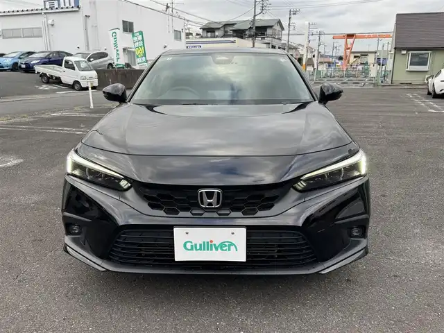 ホンダ シビック EX 静岡県 2022(令4)年 5.6万km クリスタルブラックパール ワンオーナー/ホンダセンシング/渋滞追従機能付クルーズコントロール/トラフィックジャムアシスト/アダプティブドライビングビーム/純正ナビ/・Bluetooth・フルセグTV/・ハンズフリー・USB・iPod/・車内Wi-Fi（別途プラン購入が必要）/・AM/FMラジオ・スマートフォン連携/BOSEプレミアムサウンドシステム/ワイヤレス充電器/バックカメラ/ビルトインETC2.0/10.2インチデジタルグラフィックメーター/ハーフレザーシート/前席パワーシート/（運転席8Way/助手席4Way）/前席シートヒーター/パドルシフト/フットライト/シートアンダーライト/センターコンソールボックスイルミ/ドリンクホルダーイルミ/スマートキー（スペア有り）/プッシュスタート/LEDフォグランプ/フロアマット/ドアバイザー/純正18インチAW/ウィンカーミラー/オートリトラクタブルミラー/取説・新車時保証書