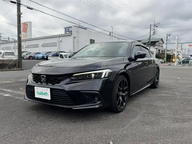 ホンダ シビック EX 静岡県 2022(令4)年 5.6万km クリスタルブラックパール ワンオーナー/ホンダセンシング/渋滞追従機能付クルーズコントロール/トラフィックジャムアシスト/アダプティブドライビングビーム/純正ナビ/・Bluetooth・フルセグTV/・ハンズフリー・USB・iPod/・車内Wi-Fi（別途プラン購入が必要）/・AM/FMラジオ・スマートフォン連携/BOSEプレミアムサウンドシステム/ワイヤレス充電器/バックカメラ/ビルトインETC2.0/10.2インチデジタルグラフィックメーター/ハーフレザーシート/前席パワーシート/（運転席8Way/助手席4Way）/前席シートヒーター/パドルシフト/フットライト/シートアンダーライト/センターコンソールボックスイルミ/ドリンクホルダーイルミ/スマートキー（スペア有り）/プッシュスタート/LEDフォグランプ/フロアマット/ドアバイザー/純正18インチAW/ウィンカーミラー/オートリトラクタブルミラー/取説・新車時保証書