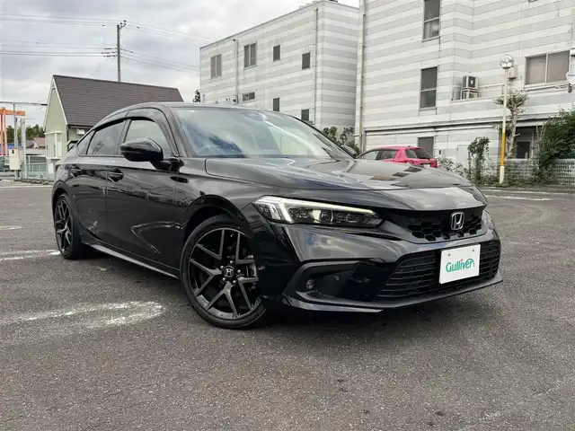 ホンダ シビック EX 静岡県 2022(令4)年 5.6万km クリスタルブラックパール ワンオーナー/ホンダセンシング/渋滞追従機能付クルーズコントロール/トラフィックジャムアシスト/アダプティブドライビングビーム/純正ナビ/・Bluetooth・フルセグTV/・ハンズフリー・USB・iPod/・車内Wi-Fi（別途プラン購入が必要）/・AM/FMラジオ・スマートフォン連携/BOSEプレミアムサウンドシステム/ワイヤレス充電器/バックカメラ/ビルトインETC2.0/10.2インチデジタルグラフィックメーター/ハーフレザーシート/前席パワーシート/（運転席8Way/助手席4Way）/前席シートヒーター/パドルシフト/フットライト/シートアンダーライト/センターコンソールボックスイルミ/ドリンクホルダーイルミ/スマートキー（スペア有り）/プッシュスタート/LEDフォグランプ/フロアマット/ドアバイザー/純正18インチAW/ウィンカーミラー/オートリトラクタブルミラー/取説・新車時保証書