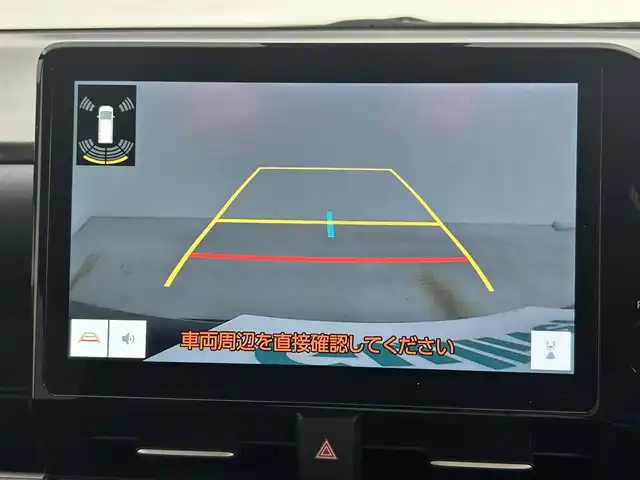 トヨタ ヴォクシー ハイブリッド S－Z 岡山県 2024(令6)年 1.9万km グリッターブラックガラスフレーク 快適利便パッケージ/ハーフレザーシート/純正10.5インチディスプレイオーディオ/　「ナビ/フルセグ/Bluetooth/DVD/ Carplay」/ブラインドスポットモニター/バックカメラ/ユニバーサルステップ（左回りのみ）/追従型クルーズコントロール/オートハイビーム/LEDヘッドライト/ビルトインETC2.0/両側パワースライドドア/シートヒーター(1列目/2列目)/衝突軽減ブレーキシステム/車線逸脱防止システム/横滑り防止装置/純正17インチアルミホイール/コーナーセンサー（前後）/純正フロアマット/ステアリングスイッチ/プッシュスタート/スマートキー×1