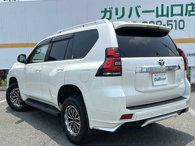 トヨタ ランドクルーザー プラド TX Lパッケージ 山口県 2023(令5)年 3.7万km ホワイトパールクリスタルシャイン ワンオーナー/サンルーフ/純正ナビ/BT/USB/Miracast/全周囲カメラ/ベージュ革シート/前席パワーシート/シートヒーター/エアシート/サードシート電動収納/純正LEDヘッドライト/純正フォグランプ/オートライト/オートハイビーム/社外１７インチアルミホイール/モデリスタエアロ/革巻きステアリング/ステアリングスイッチ/クルーズコントロール/衝突被害軽減ブレーキ/LKA/BSM/横滑り防止/コーナーセンサー/ルーフレール/スマートキー×２/純正フロアマット/純正ドアバイザー/ビルトインETC2.0/電動格納ウインカードアミラー(オート機能付き)
