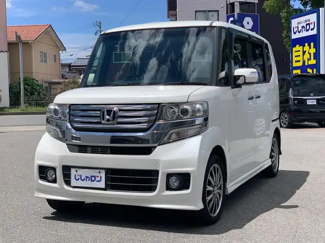 ホンダ Ｎ ＢＯＸ カスタム G ターボSSパッケージ 福井県 2014(平26)年 6万km プレミアムホワイトパール (株)IDOMが運営する【じしゃロン福井店】の自社ローン対象車両になります。こちらは現金またはオートローンご利用時の価格です。自社ローンご希望の方は別途その旨お申付け下さい/社外ナビ（CD・DVD・BT接続可）/フルセグテレビ/バックカメラ/ETC/両側パワースライドドア/クルーズコントロール/CTBA/HID/純正フロアマット