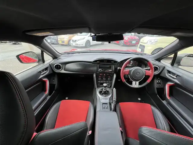 トヨタ ８６ GT リミテッド 三重県 2012(平24)年 13.9万km ライトニングレッド 6速MT/車高調（BLITZ）/フロントエアロ（トラスト）/リアエアロ/リアスポイラー/社外ホイール(RAYS　グラムライツ57CR）/社外オーディオ（Bluetooth/AM/FM/USB）/ドライブレコーダー（前）/ETC/社外エアクリーナー/ハーフレザー/シートヒーター（運転席/助手席）/オートライト/無塗装ディフューザー付同色リアバンパー/マフラーカッター/リアスポイラー/リアフォグランプ/フロアアンダーカバー/革/アルカンターラコンビシート/ウォークイン機構（助手席）/スペアキー