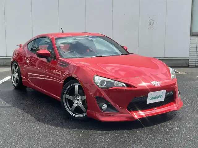 トヨタ ８６ GT リミテッド 三重県 2012(平24)年 13.9万km ライトニングレッド 6速MT/車高調（BLITZ）/フロントエアロ（トラスト）/リアエアロ/リアスポイラー/社外ホイール(RAYS　グラムライツ57CR）/社外オーディオ（Bluetooth/AM/FM/USB）/ドライブレコーダー（前）/ETC/社外エアクリーナー/ハーフレザー/シートヒーター（運転席/助手席）/オートライト/無塗装ディフューザー付同色リアバンパー/マフラーカッター/リアスポイラー/リアフォグランプ/フロアアンダーカバー/革/アルカンターラコンビシート/ウォークイン機構（助手席）/スペアキー