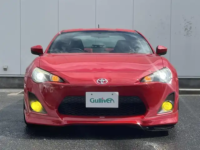 トヨタ ８６ GT リミテッド 三重県 2012(平24)年 13.9万km ライトニングレッド 6速MT/車高調（BLITZ）/フロントエアロ（トラスト）/リアエアロ/リアスポイラー/社外ホイール(RAYS　グラムライツ57CR）/社外オーディオ（Bluetooth/AM/FM/USB）/ドライブレコーダー（前）/ETC/社外エアクリーナー/ハーフレザー/シートヒーター（運転席/助手席）/オートライト/無塗装ディフューザー付同色リアバンパー/マフラーカッター/リアスポイラー/リアフォグランプ/フロアアンダーカバー/革/アルカンターラコンビシート/ウォークイン機構（助手席）/スペアキー