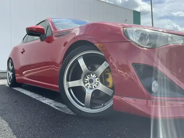 トヨタ ８６ GT リミテッド 三重県 2012(平24)年 13.9万km ライトニングレッド 6速MT/車高調（BLITZ）/フロントエアロ（トラスト）/リアエアロ/リアスポイラー/社外ホイール(RAYS　グラムライツ57CR）/社外オーディオ（Bluetooth/AM/FM/USB）/ドライブレコーダー（前）/ETC/社外エアクリーナー/ハーフレザー/シートヒーター（運転席/助手席）/オートライト/無塗装ディフューザー付同色リアバンパー/マフラーカッター/リアスポイラー/リアフォグランプ/フロアアンダーカバー/革/アルカンターラコンビシート/ウォークイン機構（助手席）/スペアキー