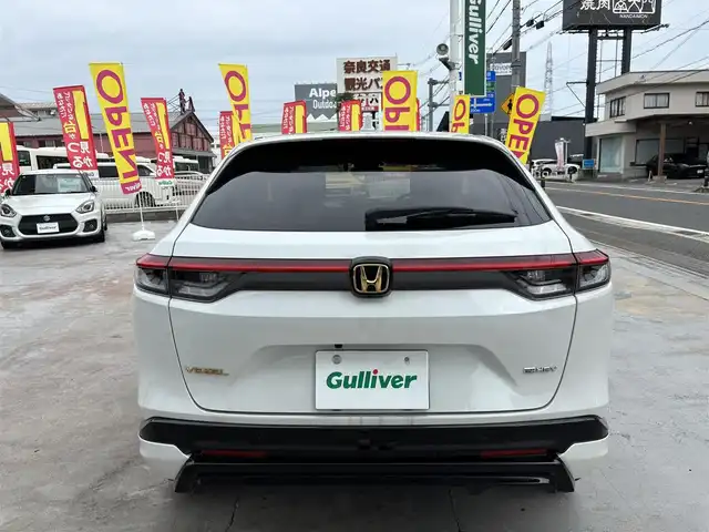 ホンダ ヴェゼル ハイブリッド e:HEV Z 京都府 2023(令5)年 1万km プラチナホワイトパール ワンオーナー/禁煙車/9966キロ/純正ナビ(MuSic rock)有りCD/DVD再生可能/Bluetooth/純正ドライブレコーダー前後/バックカメラ/レーダークルーズ/無限エアロ/USB/シートヒーター/シートカバー/ETC/フルセグTV/スマートキー2個/ブラインドスポット/ステアリングヒーター/保証書/説明書