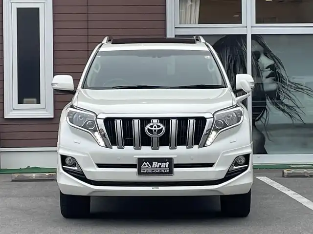 トヨタ ランドクルーザー プラド TXLパッケージ G－フロンティア 栃木県 2017(平29)年 7万km ホワイトパールクリスタルシャイン 【内装】/サンルーフ　/茶革シート　/前席パワーシート　/前席シートヒーター　/アルパイン 8型ナビ/CD/DVD/Blutooth/フルセグTV /バックカメラ　/アルパインフリップダウンモニター　/電動格納サードシート　/ドライブレコーダー/【外装】/モデリスタエアロ　/純正18インチアルミホイール　/サイドバイザー　