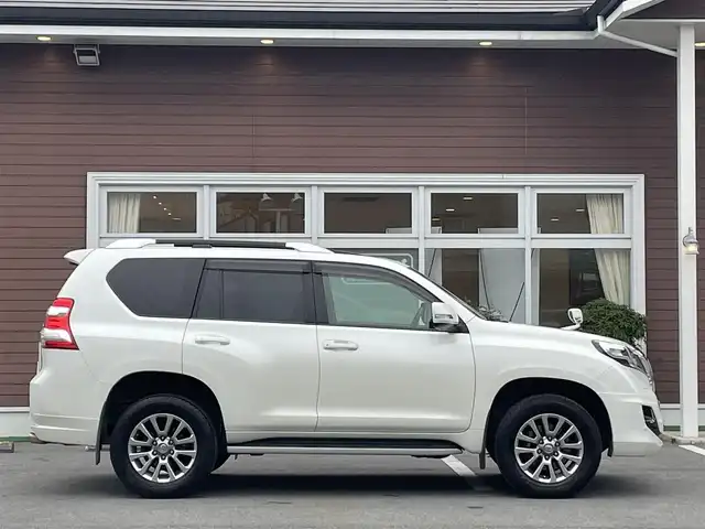 トヨタ ランドクルーザー プラド TXLパッケージ G－フロンティア 栃木県 2017(平29)年 7万km ホワイトパールクリスタルシャイン 【内装】/サンルーフ　/茶革シート　/前席パワーシート　/前席シートヒーター　/アルパイン 8型ナビ/CD/DVD/Blutooth/フルセグTV /バックカメラ　/アルパインフリップダウンモニター　/電動格納サードシート　/ドライブレコーダー/【外装】/モデリスタエアロ　/純正18インチアルミホイール　/サイドバイザー　