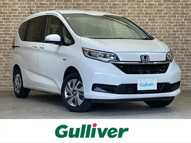 ホンダ フリード ハイブリット G ホンダセンシング 岩手県 2022(令4)年 3.4万km プラチナホワイトパール ４WD/両側パワースライドドア/シートヒーター/ホンダセンシング/衝突被害軽減ブレーキ/レーンアシスト/クルーズコントロール/先行車発進お知らせ機能/アイドリングストップ/KENWOODナビ（Bluetooth CD ワンセグ）/ドライブレコーダー/ETC/熱線入りフロントウインドウ/ステアリングスイッチ/LEDヘッドライト/オートエアコン/オートライト/ロールサンシェード/３列シート/ウォークスルー/純正ホイールキャップ
