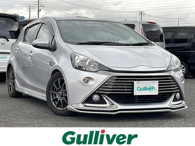 トヨタ アクア G G’s 道央・札幌 2015(平27)年 13.4万km シルバーM 寒冷地仕様/社外メモリーナビ/AM/FM/BT/CD/DVD/SD/フルセグ/横滑り防止装置/バックカメラ/ビルトインETC/ドライブレコーダー/アイドリングストップ/ワイパーデアイサー/ECOMODE/EVMODE/前席シートヒーター/ハーフレザーシート/革巻きステアリング/ステアリングリモコン/プッシュスタート/スマートキー/LEDヘッドライト/オートライト/フォグランプ/電動格納ミラー/ウィンカーミラー/純正フロアマット/ドアバイザー/スペアキー/純正エンジンスターター
