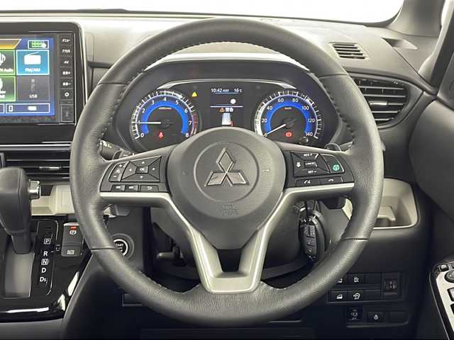 三菱 デリカミニ T プレミアム リミテッド ED 愛知県 2025(令7)年 0.1千km アメジストブラック/シルキーホワイト 未使用車・新車/９型ディスプレイオーディオ/全方位カメラ/Bluetooth・AppleCarPlay・AndroidAuto・USB/ルーフレール/ファブリック＆合皮シート/前席シートヒーター/純正フロアマット/ヒルディセントコントロール/ヒルスタートアシスト/アイドリングストップ/ACC/車線維持支援/車線逸脱警報/先行車発進告知/LEDヘッドライト/オートライト/オートマチックハイビーム/革巻きステアリング/ステアリングスイッチ/パドルシフト/電子パーキングブレーキ/オートホールド/スマートキー/プッシュスタート/スペアキー/新車保証書・取扱説明書