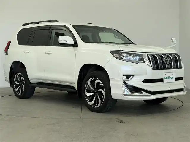 トヨタ ランドクルーザー プラド TX 愛知県 2020(令2)年 3.5万km ホワイトパールクリスタルシャイン モデリスタエアロ（F/R）/プリクラッシュセーフティ/レーダークルーズコントロール/レーンキープアシスト/オートマチックハイビーム/クリアランスソナー/ルーフレール/社外ナビ/Bluetooth/フルセグTV/DVD/CD/AM/FM/USB/社外フロアマット/社外20インチアルミホイール/LEDヘッドライト/オートライト/前方ドライブレコーダー/ETC/スマートキー