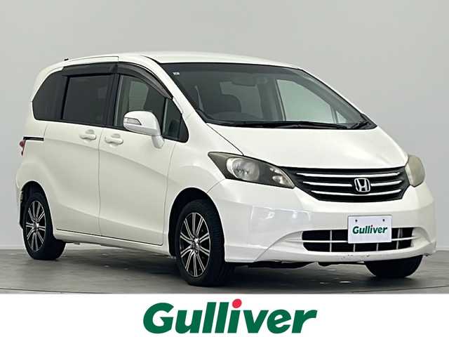 ホンダ フリード G ジャストセレクション 大阪府 2011(平23)年 11.8万km プレミアムホワイトパール 社外７インチSDナビ（MDV-D404BT）/TV/CD/DVD/ブルートゥース/バックカメラ/片側パワースライドドア/ETC/前方ドライブレコーダー/社外１５インチAW