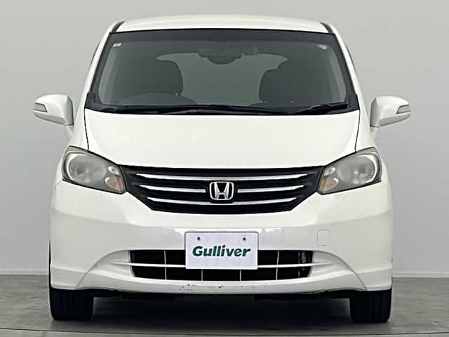ホンダ フリード G ジャストセレクション 大阪府 2011(平23)年 11.8万km プレミアムホワイトパール 社外７インチSDナビ（MDV-D404BT）/TV/CD/DVD/ブルートゥース/バックカメラ/片側パワースライドドア/ETC/前方ドライブレコーダー/社外１５インチAW