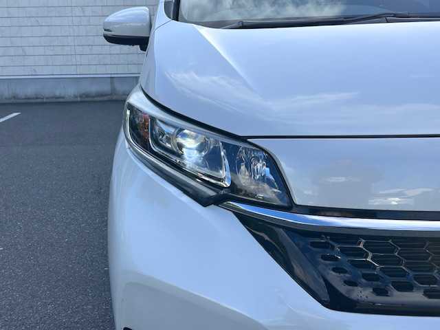 ホンダ フリード G ホンダセンシング 大阪府 2021(令3)年 2.6万km プラチナホワイトパール 純正９インチナビ　/フルセグ　/Ｂｌｕｅｔｏｏｔｈ　/バックカメラ　/フリップダウンモニター　/両側パワースライドドア　/シートヒーター　/レーダークルーズコントロール　/ＬＥＤヘッドライト　/ＥＴＣ　/ドラレコ