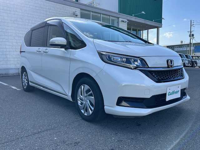 ホンダ フリード G ホンダセンシング 大阪府 2021(令3)年 2.6万km プラチナホワイトパール 純正９インチナビ　/フルセグ　/Ｂｌｕｅｔｏｏｔｈ　/バックカメラ　/フリップダウンモニター　/両側パワースライドドア　/シートヒーター　/レーダークルーズコントロール　/ＬＥＤヘッドライト　/ＥＴＣ　/ドラレコ
