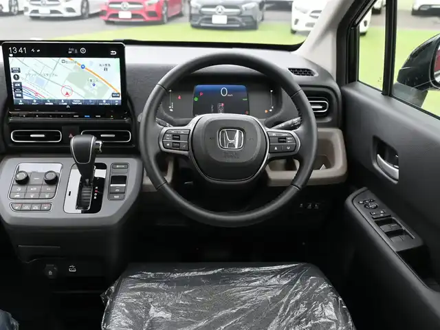 ホンダ フリード ハイブリット e:HEV AIR EX 千葉県 2025(令7)年 0.1千km クリスタルブラックパール ホンダセンシング/・衝突軽減ブレーキ（CMBS）/・車線維持支援システム（LKAS）/・アダプティブクルーズコントロール（ACC）/・ブラインドスポットインフォメーション/・後方誤発進抑制機能/・誤発進抑制機能/両側パワースライドドア/ハーフレザーシート/前席シートヒーター/11.4インチホンダコネクトナビ/地デジTV/【DVD/CD再生機能　Bluetooth接続】/バックカメラ/革巻きステアリング/ステアリングスイッチ/LEDヘッドライト/ウインカーミラー/コーナーセンサー/純正15インチアルミホイル/サイド/カーテンエアバッグ/Honda スマートキー