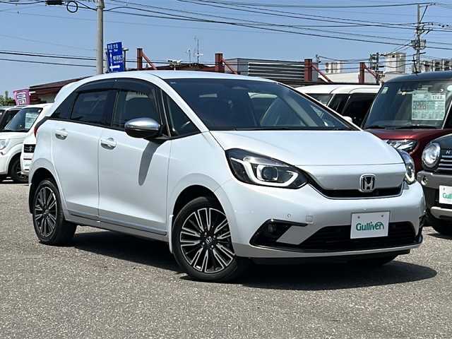 ホンダ フィット e:HEVリュクス 秋田県 2020(令2)年 9.3万km プレミアムサンライトホワイトパール ４WD/純正SDナビ/純正AW/ステアリングヒーター/前後ドライブレコーダー/前後コーナーセンサー