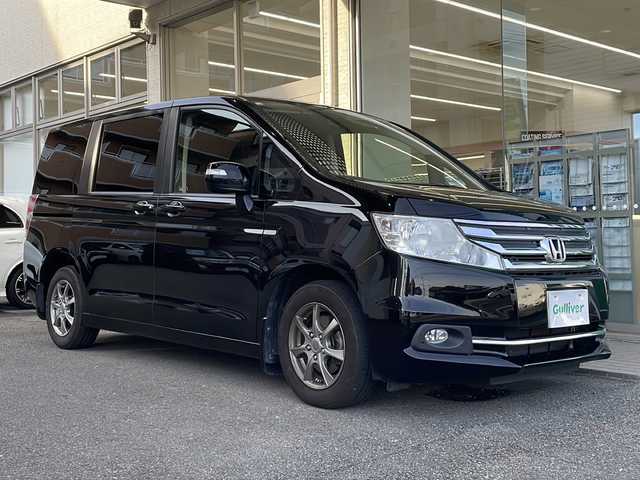ホンダ ステップワゴン G コンフォートセレクション 高知県 2012(平24)年 10.6万km クリスタルブラックパール 純正フリップダウンモニター(Gathers　VM-108N）　/フルセグナビ　（MDV-S706）/【Ｂｌｕｅｔｏｏｔｈ　ＣＤ　ＤＶＤ　ＴＶ】　/両側パワースライドドア　/ビルトインＥＴＣ　/クルーズコントロール　/社外15インチアルミホイール/純正フロアマット　/横滑り防止装置/オートライト/保証書　/取扱説明書