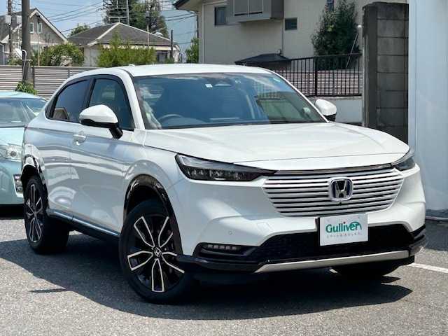 ホンダ ヴェゼル ハイブリッド e:HEV Z 東京都 2022(令4)年 1.3万km プラチナホワイトパール 走行距離12984km/ワンオーナー/純正メモリーナビ（AM・FM・フルセグ・BT）/ホンダセンシング/・衝突軽減ブレーキ/・誤発進抑制機能/・渋滞追従機能付アダプティブクルーズコントロール/・車線維持支援システム/・路外逸脱抑制機能/・オートハイビーム/全方位カメラ/ブラインドスポットモニター/シーケンシャルターンランプ/ハンズフリーパワーバックドア/ハーフレザーシート（合皮）/シートヒーター/コーナーセンサー（前後）/ETC2.0/ドライブレコーダー（前後）/置き充電/保証書、取説/スペアキー有り（1本）