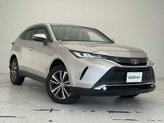 トヨタ ハリアー ハイブリッド G 沖縄県 2020(令2)年 4万km スティールブロンドM 純正ディスプレイオーディオ　ナビ付/　（フルセグTV/ラジオ/Bluetooth）/バックカメラ/ドライブレコーダー/ブラインドスポットモニター/電動パーキングブレーキ/パワーバックドア/純正デジタルインナーミラー/ハーフレザーシート/トヨタセーフティセンス/・衝突被害軽減ブレーキ (プリクラッシュセーフティ)																									/・ハンドル操作サポート (レーントレーシングアシスト)																									/・追従ドライブ支援機能 (レーダークルーズコントロール)																									/・車線はみ出しアラート (レーンディパーチャーアラート)																									/・自動ハイビーム (オートマチックハイビーム)	/スマートキー/スペアキー/プッシュスタート/純正フロアマット/純正18インチアルミホイール/LEDヘッドライト/オートライト/保証書/取扱説明書
