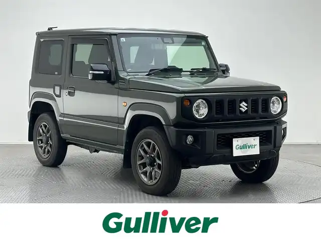 スズキ ジムニー XC 兵庫県 2019(令1)年 2.4万km ジャングルグリーン ・純正メモリナビ/（CD、DVD、SD、BT、フルセグ）　/・クルーズコントロール/・LKA/・PCS/・トランスファー/・社外インテークチャンバー/・４WD　/・前後ドライブレコーダー　/・ビルトインETC　/・バックカメラ　/・シートヒーター　/・純正ラバーマット　/・純正16インチAW　/・背面タイヤ　/・ROSSOMODELOOマフラー　/・純正マフラー積込/・純正バイザー/・純正リアスポイラー/・社外フューエルリッド/・LEDヘッドライト/・LEDフォグランプ/・社外ウーファー