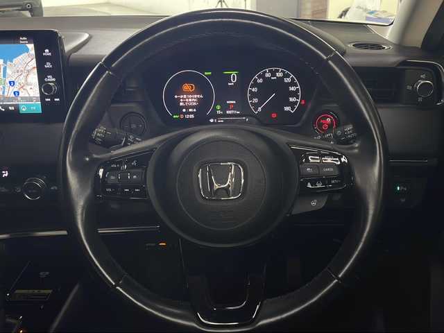 ホンダ ヴェゼル ハイブリッド e:HEV Z 広島県 2021(令3)年 3.3万km クリスタルブラックパール 純正９型ナビ　/シートヒーター　/フルセグＴＶ　/バックカメラ/レーダークルーズコントロール　/パワーバックドア　/ステアリングヒーター　/オートハイビーム　/ワイヤレス充電　/レーンキープアシスト　/ETC　/ドラレコ/純正18インチアルミホイール(225/50/R18)/エアバック（運転席/助手席/サイド/カーテン）