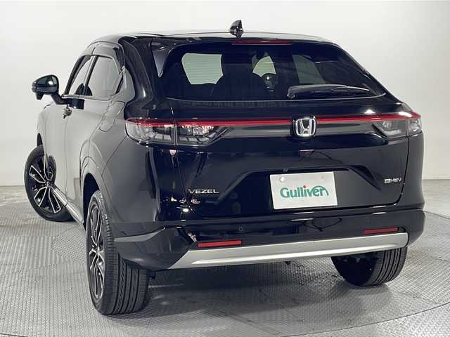 ホンダ ヴェゼル ハイブリッド e:HEV Z 広島県 2021(令3)年 3.3万km クリスタルブラックパール 純正９型ナビ　/シートヒーター　/フルセグＴＶ　/バックカメラ/レーダークルーズコントロール　/パワーバックドア　/ステアリングヒーター　/オートハイビーム　/ワイヤレス充電　/レーンキープアシスト　/ETC　/ドラレコ/純正18インチアルミホイール(225/50/R18)/エアバック（運転席/助手席/サイド/カーテン）