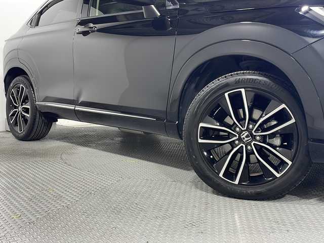 ホンダ ヴェゼル ハイブリッド e:HEV Z 広島県 2021(令3)年 3.3万km クリスタルブラックパール 純正９型ナビ　/シートヒーター　/フルセグＴＶ　/バックカメラ/レーダークルーズコントロール　/パワーバックドア　/ステアリングヒーター　/オートハイビーム　/ワイヤレス充電　/レーンキープアシスト　/ETC　/ドラレコ/純正18インチアルミホイール(225/50/R18)/エアバック（運転席/助手席/サイド/カーテン）