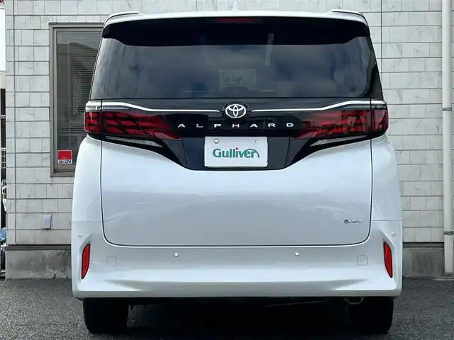 トヨタ アルファードハイブリット Z 福岡県 2024(令6)年 1.9万km プラチナホワイトパールマイカ ワンオーナー/左右独立ムーンルーフ（電動シェード付）/純正12.1インチフリップダウンモニター【V12T-R72C】/アドバンスドパーク/純正14インチコネクティッドナビ/　（Miracast/Bluetooth/フルセグTV/ナビ有）/フロント/サイド/バックカメラ/パノラミックビューモニター/トヨタセーフティーセンス/・・プリクラッシュセーフティ/・レーンディバーチャーアラート/・レーダークルーズコントロール/・レーンチェンジアシスト/・ロードサインアシスト/・プロアクティブドライビングアシスト/・フロント/リアトラフィックアラート/・ブラインドスポッドモニター/・安心降車アシスト/・後方車両接近告知/・パーキングサポートブレーキ/・クリアランスソナー/・リアカメラディテクション/オートマチックハイビーム/AC100V/純正18インチAW/両側パワースライドドア/パワーバックドア/黒色レザーシート/シートメモリ（D席）/パワーシート（D/N/）/シートヒーター/エアシート（D/N/2列目）/ステアリングヒーター/ビルトインETC2.0/デジタルインナーミラー/後席サンシェード/スペアキー×1/保証書