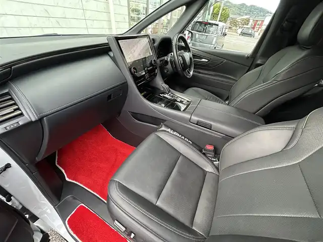 トヨタ アルファードハイブリット Z 福岡県 2024(令6)年 1.9万km プラチナホワイトパールマイカ ワンオーナー/左右独立ムーンルーフ（電動シェード付）/純正12.1インチフリップダウンモニター【V12T-R72C】/アドバンスドパーク/純正14インチコネクティッドナビ/　（Miracast/Bluetooth/フルセグTV/ナビ有）/フロント/サイド/バックカメラ/パノラミックビューモニター/トヨタセーフティーセンス/・・プリクラッシュセーフティ/・レーンディバーチャーアラート/・レーダークルーズコントロール/・レーンチェンジアシスト/・ロードサインアシスト/・プロアクティブドライビングアシスト/・フロント/リアトラフィックアラート/・ブラインドスポッドモニター/・安心降車アシスト/・後方車両接近告知/・パーキングサポートブレーキ/・クリアランスソナー/・リアカメラディテクション/オートマチックハイビーム/AC100V/純正18インチAW/両側パワースライドドア/パワーバックドア/黒色レザーシート/シートメモリ（D席）/パワーシート（D/N/）/シートヒーター/エアシート（D/N/2列目）/ステアリングヒーター/ビルトインETC2.0/デジタルインナーミラー/後席サンシェード/スペアキー×1/保証書