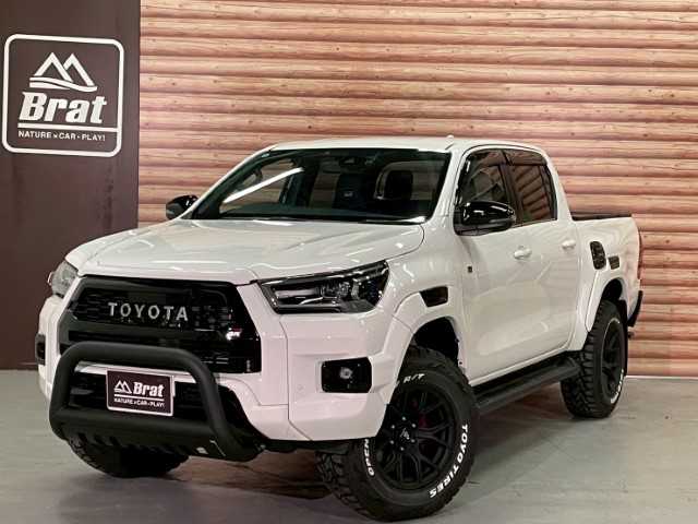 トヨタ ハイラックス Z GRスポーツ 千葉県 2022(令4)年 1.4万km スーパーホワイトⅡ AIS検査済み/【2506021541】/純正ナビ/パノラミックビューモニター/レーダークルーズ/ステアリングリモコン/パドルシフト/ETC/前後ドラレコ/トノカバー/クリアランスソナー/運転席パワーシート/LEDルームランプ/ベッドライナー/レーンディパーチャーアラート/アイドリングストップ/センターデフロック/リアフォグ/ハーフレザーシート/スマートキー/フロントフォグランプ/17AW WEDS　マッドヴァンスSD(社外）/TOYOオープンカントリーR/T（社外）/タナベ リフトアップキット（社外）/JAOSインナーフェンダー（社外）/GIギア ブルバー（社外）/社外パーツ取付有