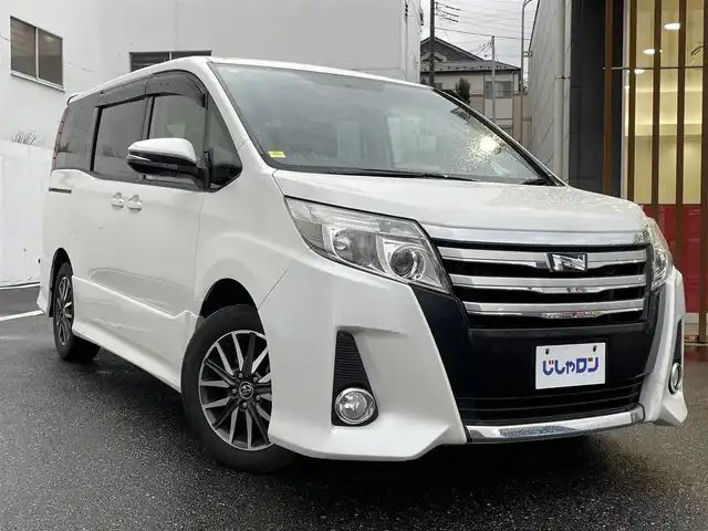 トヨタ ノア Si 千葉県 2014(平26)年 13.3万km ホワイトパールクリスタルシャイン (株)IDOMが運営する【じしゃロン八千代店】の自社ローン専用車両になります。/こちらは現金またはオートローンご利用時の価格です。自社ローンご希望の方は別途その旨お申付け下さい/10インチナビ/両側電動スライドドア/シートカバー/フルセグTVナビ/Bluetoothオーディオ対応