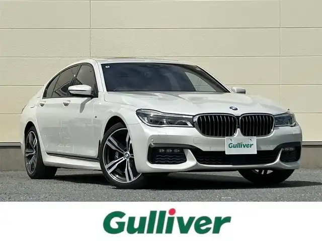 ＢＭＷ ７４０ｉ Mスポーツ 茨城県 2016(平28)年 5.5万km ミネラルホワイト 純正メーカオプションナビ/　(フルセグ/CD/DVD/Bluetooth)/全方位カメラ/黒革シート/サンルーフ/ETC/ドライビングアシスト/ハーマンカードン/クルーズコントロール/パドルシフト/パワーバックドア/プッシュスタート/USB入力端子/シートヒーター/パワーシート/LEDヘッドライト/純正アルミホイール