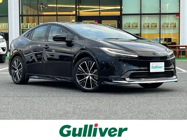 トヨタ プリウス Z 奈良県 2023(令5)年 1.2万km アティチュードブラックマイカ 純正１２．３インチディスプレイオーディオ/（フルセグ/BT/AppleCarPlay/AndroidAuto)/モデリスタフルエアロ/レーダークルーズコントロール/アラウンドビューモニター/ブラインドスポットモニター/プリクラッシュセーフティ/インテリジェントパーキングアシスト/レーンキープアシスト/電動リアゲート/ブラックレザーシート/運転席メモリ付きパワーシート/パワーイージーアクセスシステム/前席シートヒーター/前席エアーシート/ステアイングヒーター/ワイヤレス充電/デジタルインナーミラー/ETC2.0/純正19インチAW/スペアキーX1