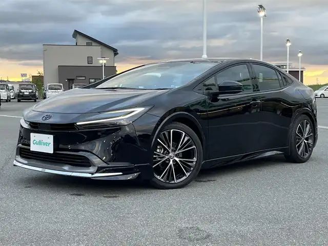 トヨタ プリウス Z 奈良県 2023(令5)年 1.2万km アティチュードブラックマイカ 純正１２．３インチディスプレイオーディオ/（フルセグ/BT/AppleCarPlay/AndroidAuto)/モデリスタフルエアロ/レーダークルーズコントロール/アラウンドビューモニター/ブラインドスポットモニター/プリクラッシュセーフティ/インテリジェントパーキングアシスト/レーンキープアシスト/電動リアゲート/ブラックレザーシート/運転席メモリ付きパワーシート/パワーイージーアクセスシステム/前席シートヒーター/前席エアーシート/ステアイングヒーター/ワイヤレス充電/デジタルインナーミラー/ETC2.0/純正19インチAW/スペアキーX1