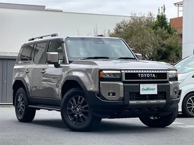 トヨタ ランドクルーザー ２５０ VX 東京都 2024(令6)年 0.3万km アバンギャルドブロンズメタリック ワンオーナー/セーフティセンス/純正メーカーフルセグナビTV/Bluetooth HDMI/全方位モニター/サンルーフ/黒革シート/パワーシート（運転席）/シートヒーター（前席）/エアシート（前席）/衝突被害軽減ブレーキ/クリアランスソナー/ブラインドスポットモニター/レーダークルーズコントロール/レーンディバーチャーアラート/発進遅れ告知機能/ドライバー異常時対応システム/オートマチックハイビーム/純正LEDヘッドライト/革巻きステアリングホイール/ステアリングヒーター/左右独立温度調整オートエアコン/充電用USB端子（1列目２列目３列目）/ISOFIX/ルーフレール/ETC2.0/スペアキー/保証書＆取扱説明書