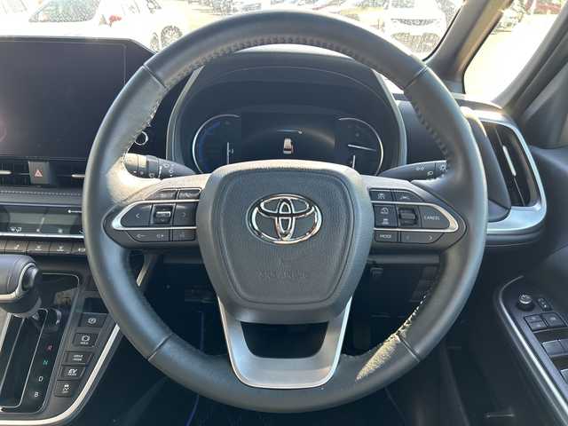 トヨタ ヴォクシー ハイブリッド S－Z 鹿児島県 2023(令5)年 1.7万km ホワイトパールクリスタルシャイン ワンオーナー/トヨタセーフティセンス/純正14インチフリップダウンモニター/純正ディスプレイオーディオ/（フルセグTV/Bluetooth/Miracast/CD/DVD/USB）/バックカメラ/両側パワースライドドア/助手席側ユニバーサルステップ/モデリスタシグネチャーイルミグリル/レーダークルーズコントロール/レーンディパーチャーアラート/プリクラッシュセーフティー/LEDヘッドライト/ハーフレザーシート/純正17インチアルミホイール/ステアリングヒーター/スマートキー/ETC2.0