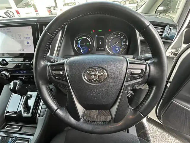 トヨタ アルファードハイブリット S 愛知県 2020(令2)年 5.7万km ホワイトパールクリスタルシャイン 純正メモリナビ(FM/AM/CD/DVD/BT/USB/Miracast/フルセグ)/トヨタセーフティーセンス/ ・レーントレーシングアシスト/ ・プリクラッシュセーフティー/ ・クリアランスソナー/ ・パーキングサポートブレーキ/ ・ロードサインアシスト/ ・レーダークルーズコントロール/ドライブレコーダー/バックカメラ/4WD/nanoe/両側パワースライドドア/LEDヘッドライト/フォグランプ/純正AW17インチ/電動格納ミラー/ETC/プッシュスタート/スマートキー・スペアキー１本/ステアリングリモコン/ハンズフリー/ABS/取扱説明書・保証書