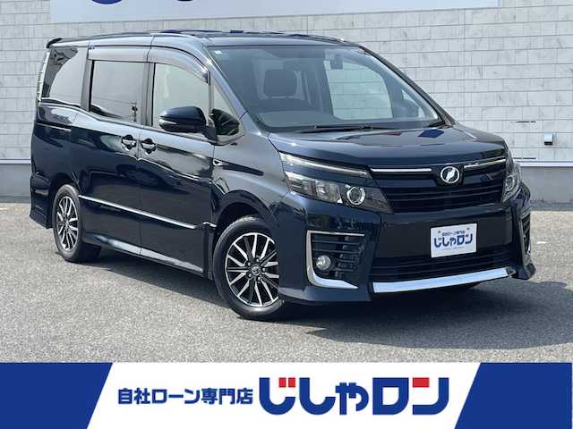 トヨタ ヴォクシー ZS 佐賀県 2014(平26)年 14.7万km ブラッキッシュアゲハガラスフレーク こちらは現金またはオートローンご利用時の価格です。/自社ローンご希望の方は別途その旨お申付け下さい/・外色:ブラキッシュアゲハガラスフレーク/・７人乗り/・両側電動スライド　/・純正ＳＤナビ/ＢＴオーディオ/フルセグ/ＤＶＤ/ＣＤ　/・社外ドラレコ　/・ＧＰＳレーダー　/・バックカメラ　/・ビルトインＥＴＣ