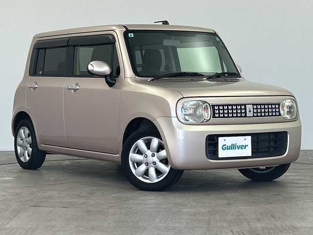 スズキ ラパン XL 三重県 2013(平25)年 4.9万km シャンパンピンクPM /禁煙車//社外SDナビ/（フルセグ/CD/DVD/AM/FM）//シートヒーター//ETC//純正14インチアルミホイール//アイドリングストップ//革巻きステアリング//プッシュスタート//スマートキー//ウィンカーミラー//電動格納ミラー//純正フロアマット