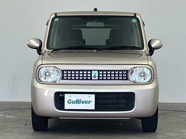 スズキ ラパン XL 三重県 2013(平25)年 4.9万km シャンパンピンクPM /禁煙車//社外SDナビ/（フルセグ/CD/DVD/AM/FM）//シートヒーター//ETC//純正14インチアルミホイール//アイドリングストップ//革巻きステアリング//プッシュスタート//スマートキー//ウィンカーミラー//電動格納ミラー//純正フロアマット