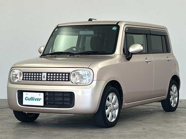 スズキ ラパン XL 三重県 2013(平25)年 4.9万km シャンパンピンクPM /禁煙車//社外SDナビ/（フルセグ/CD/DVD/AM/FM）//シートヒーター//ETC//純正14インチアルミホイール//アイドリングストップ//革巻きステアリング//プッシュスタート//スマートキー//ウィンカーミラー//電動格納ミラー//純正フロアマット