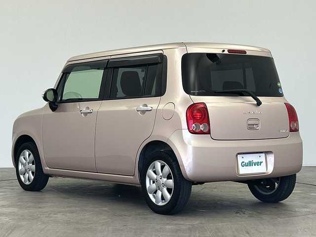 スズキ ラパン XL 三重県 2013(平25)年 4.9万km シャンパンピンクPM /禁煙車//社外SDナビ/（フルセグ/CD/DVD/AM/FM）//シートヒーター//ETC//純正14インチアルミホイール//アイドリングストップ//革巻きステアリング//プッシュスタート//スマートキー//ウィンカーミラー//電動格納ミラー//純正フロアマット