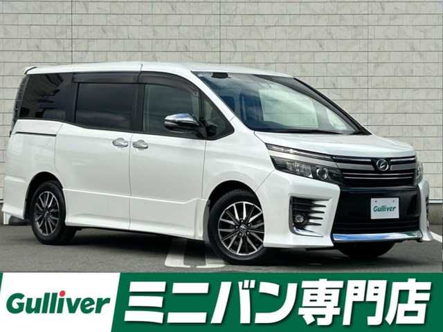 トヨタ ヴォクシー ZS 煌Ⅱ 福岡県 2016(平28)年 7.9万km ホワイトパールクリスタルシャイン 純正9型SDナビ(フルセグTV/CD/DVD/BT)/トヨタセーフティ/後席フリップダウンモニター/両側電動/ステアリングスイッチ/ETC/純正LED/純正フロアマット/純正アルミホイール/スペアキー/プッシュスタート/スマートキー